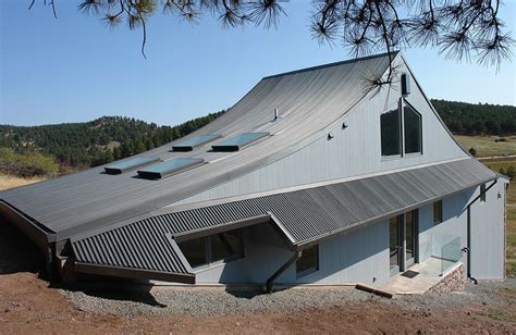 what are those curved corrugated metal roofed houses called|curved metal roof.